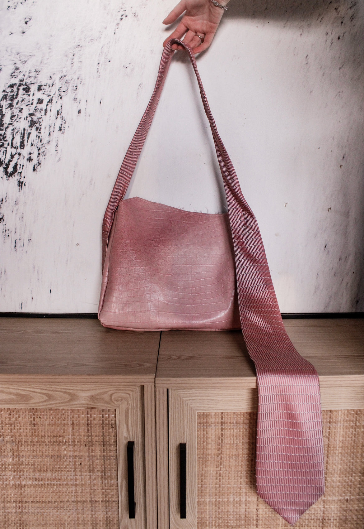 pink tied up leather purse