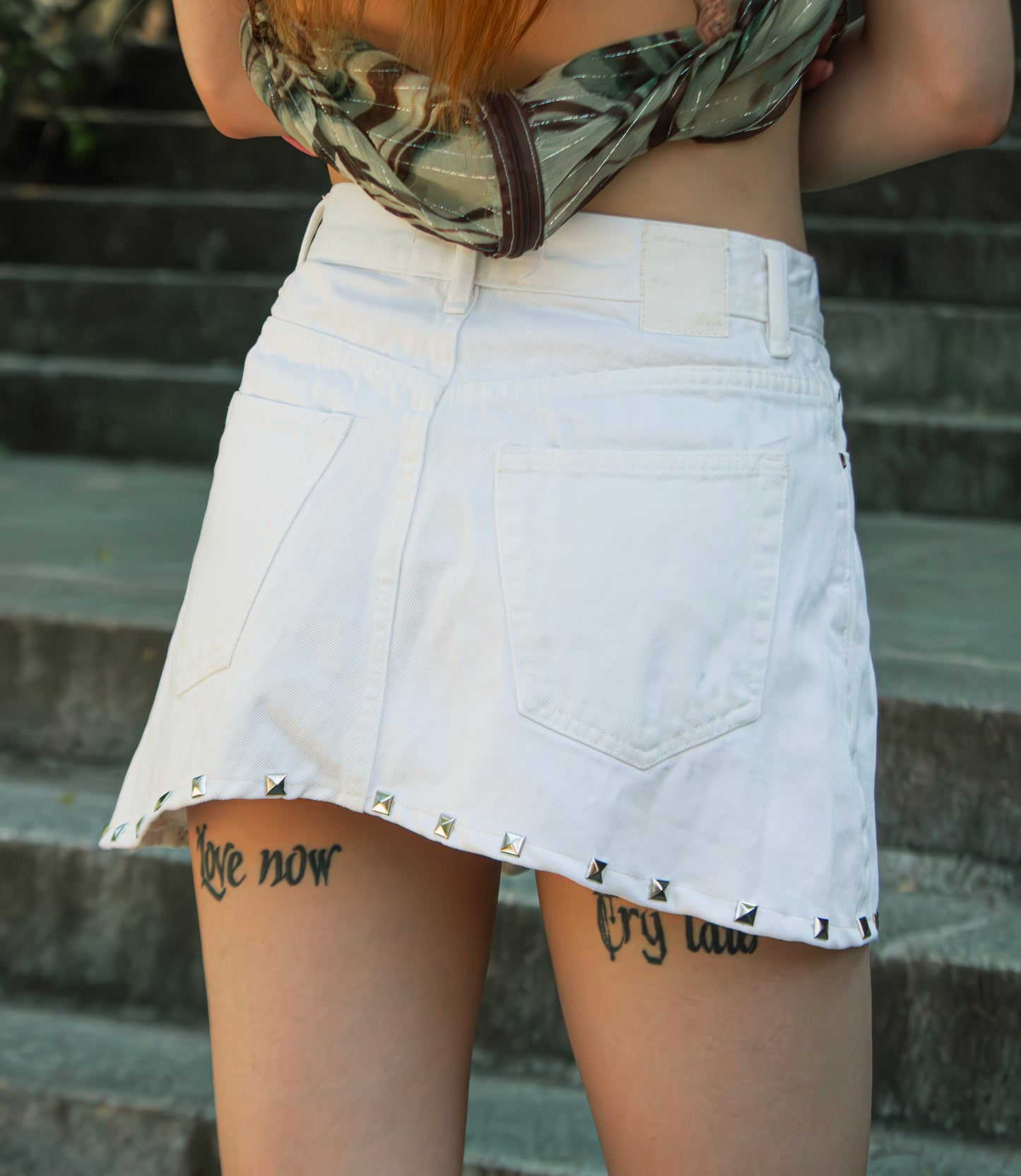 stud pleated white denim mini