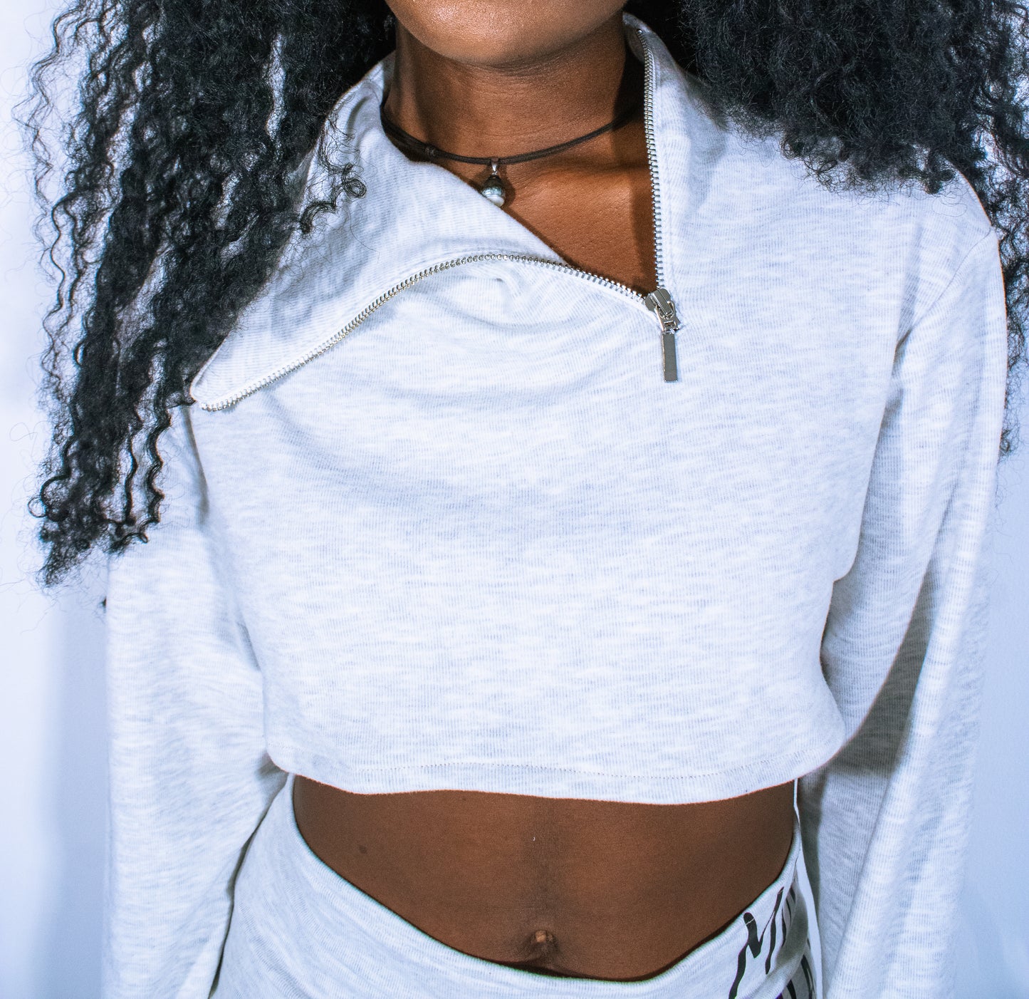 asymmetrical micro-crop quarter zip