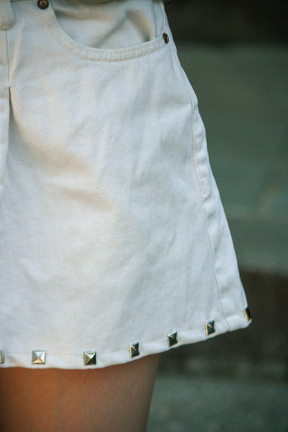 stud pleated white denim mini